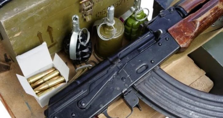 A file picture of an AK47 rifle and ammunition